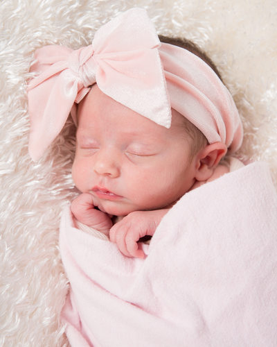 Sleeping Baby Girl in Pink Swaddle with Big Bow 