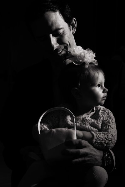 Black and white moody image of flower girl