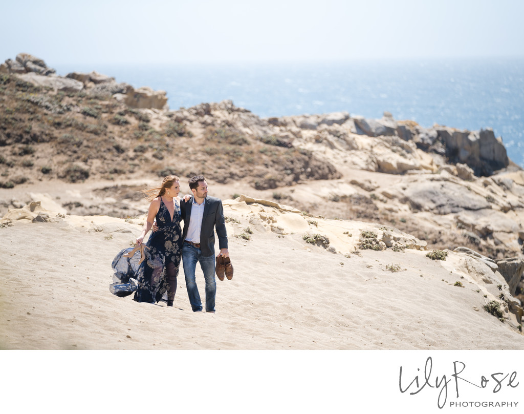 Engaged Couple along the Beach at Timber Cove Resort
