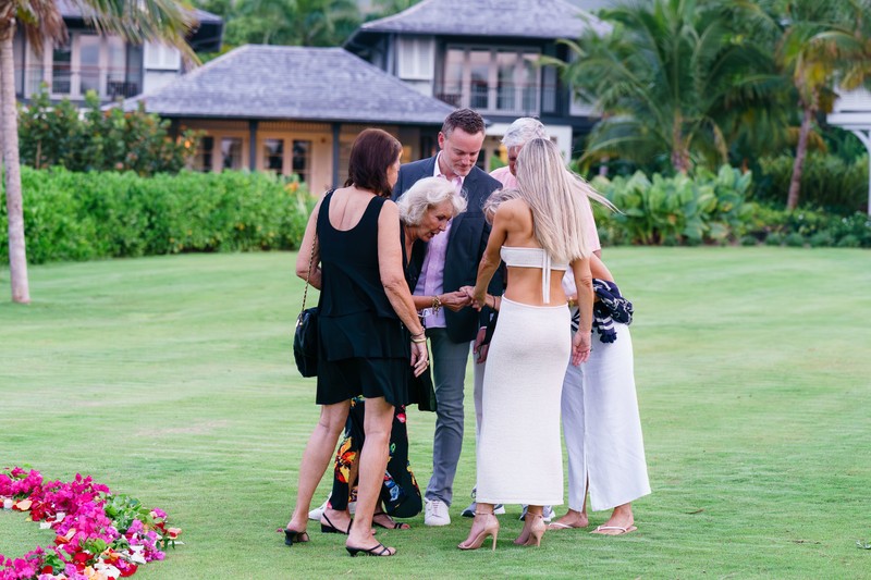 Family looking at engagement ring Half Moon Jamaica Family looking at engagement ring Half Moon Jamaica