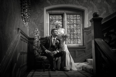 Bride & Groom on staircase during their Wedding at Moxhull Hall.