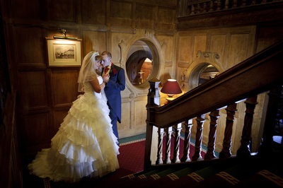 Bride & Groom photographed on staircase at Moor Hall Hotel.