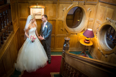 Bride & Groom photographed together on staircase at Moor Hall Hotel.
