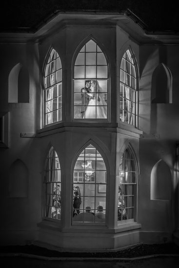 Bride & Groom together in the window at Warwick House