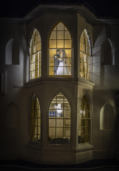Bride & Groom in Windows at Warwick House