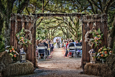 An outdoor wedding in Florida thru custom wood doors.