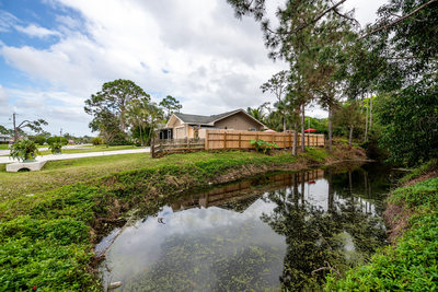 Real Estate exterior photo showing large lot and water