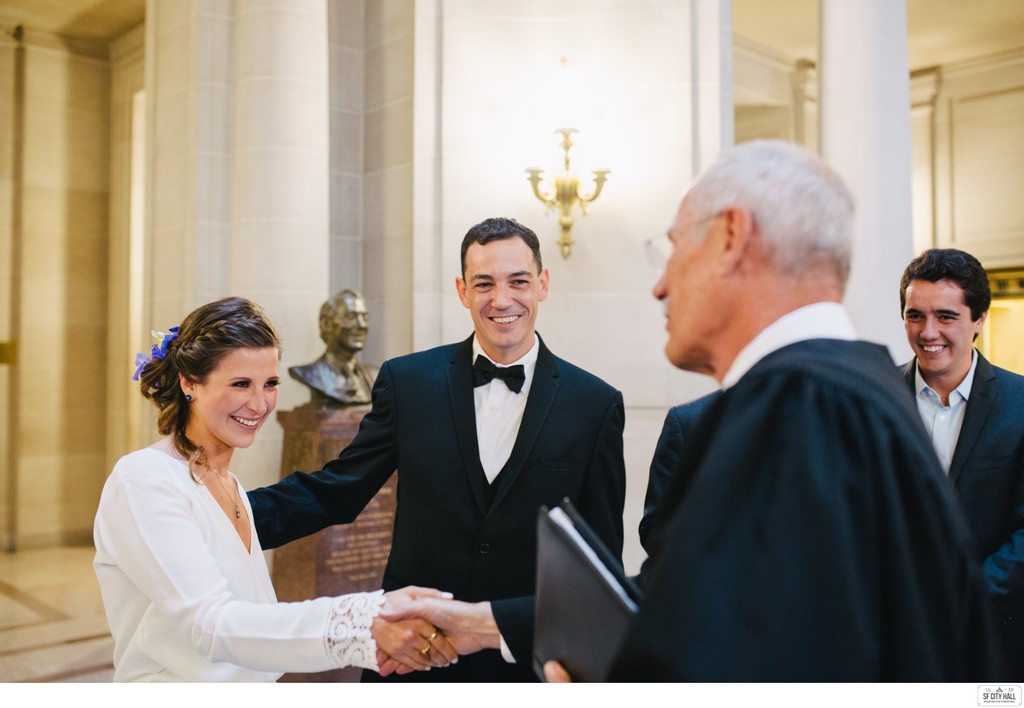 Couple and Wedding Officiant at SF City Hall