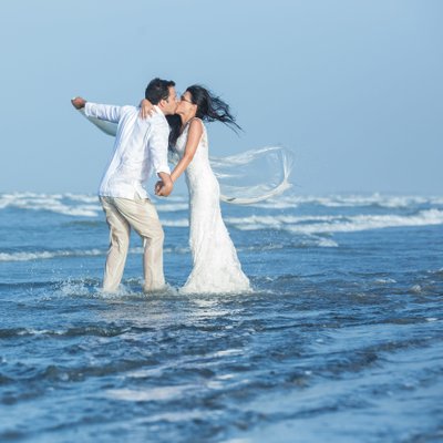 Beach destination wedding: Bride & Groom kiss