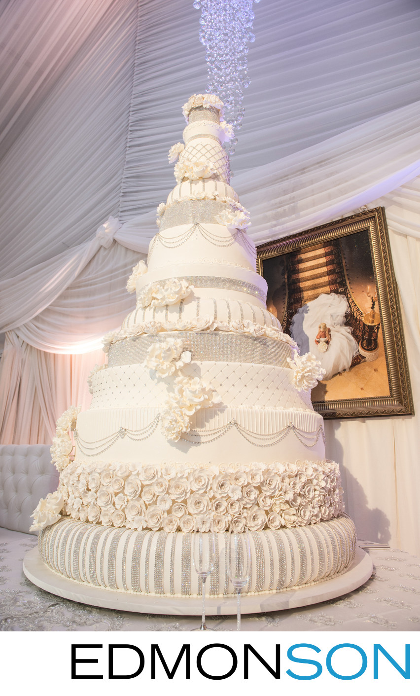 Grand Wedding Cake Towers Over Reception