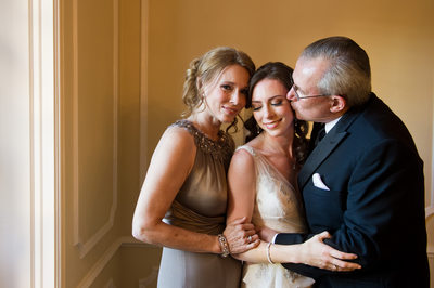 Loving Parents Embraces Warwick Melrose Bride