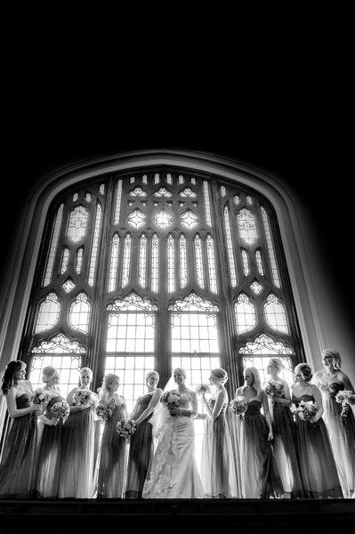 Huge Glass Window Creates Epic Bridal Party Photo