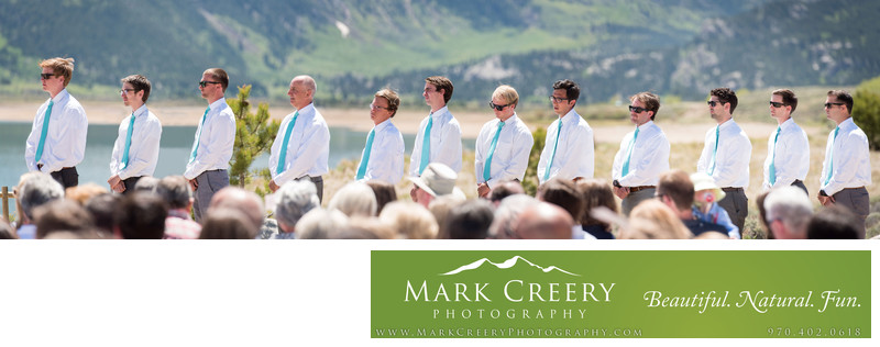 12 Groomsmen lined up during wedding ceremony in Colorado