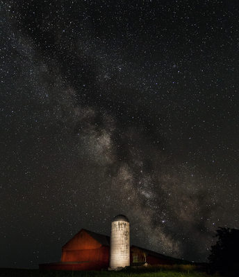 Milky way over red barn