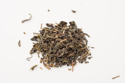 pile of dry green tea leaves