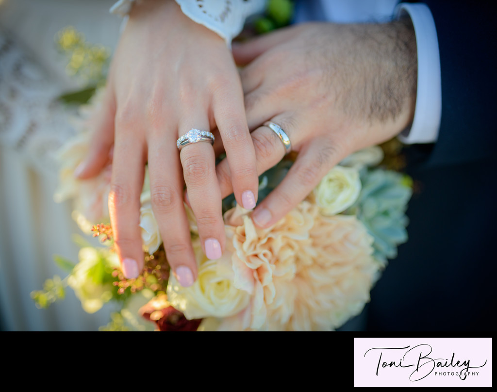 His and hers wedding rings with flowers