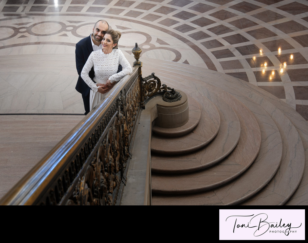 Amazing railing photo with bride and groom