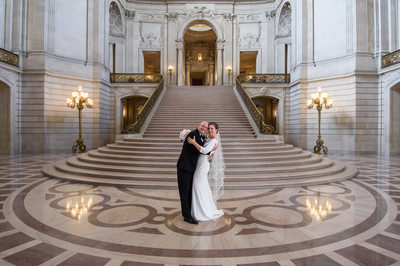 City Hall wedding photography grand staircase with happy couple