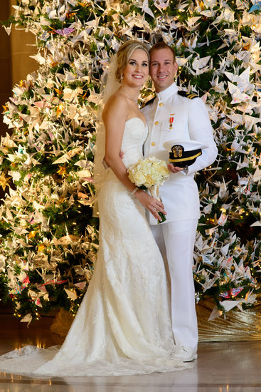 Beautiful decorated Christmas Tree with bride and groom