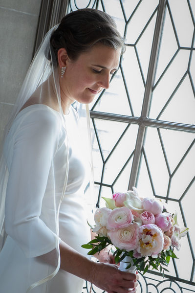 bride and bouquet in city hall light