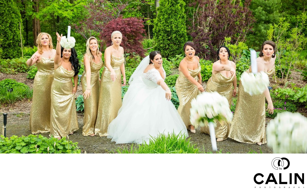 Bridal Party Throw Bouquets at Photographer 