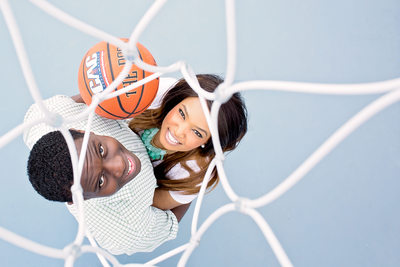 Engaged Couple Under a Basketball Hoop