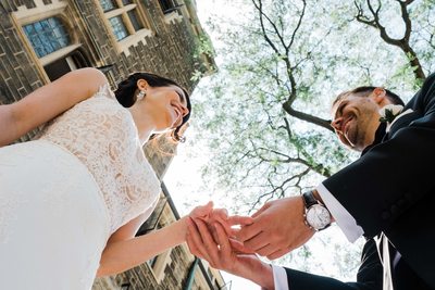 Bride and Groom Exchange Rings at Storys Building Wedding