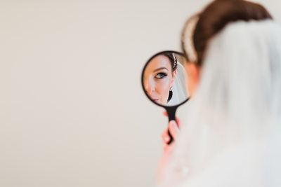 Beautiful Bride is Looking in the Mirror