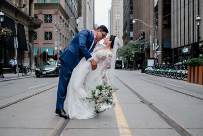 Bride and Groom Kiss in front of King Edward Hotel
