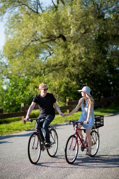Engagement Photo of a Couple Riding a Bike