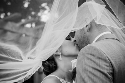 Kissing Under the Veil | Black and White Wedding Photo