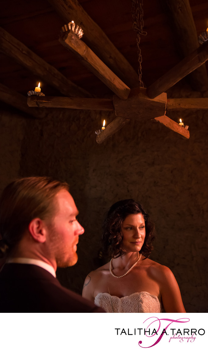 Adobe walls and candle light for an intimate wedding ceremony