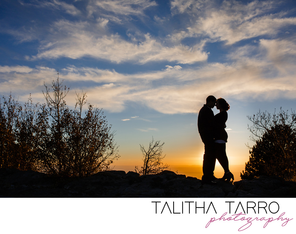 Couple silhouette on the mountain top 