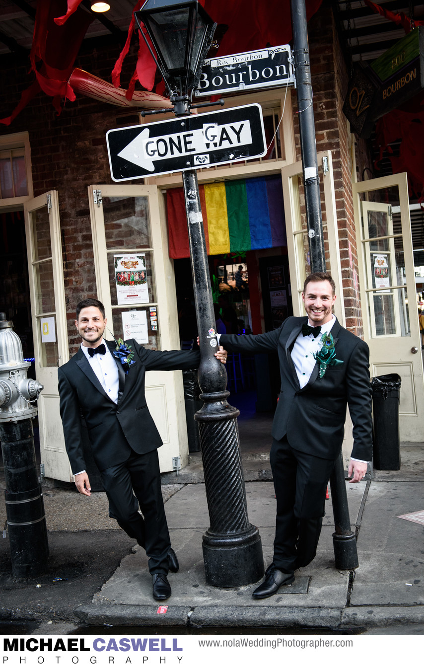 Two Grooms by Gone Gay Street Sign
