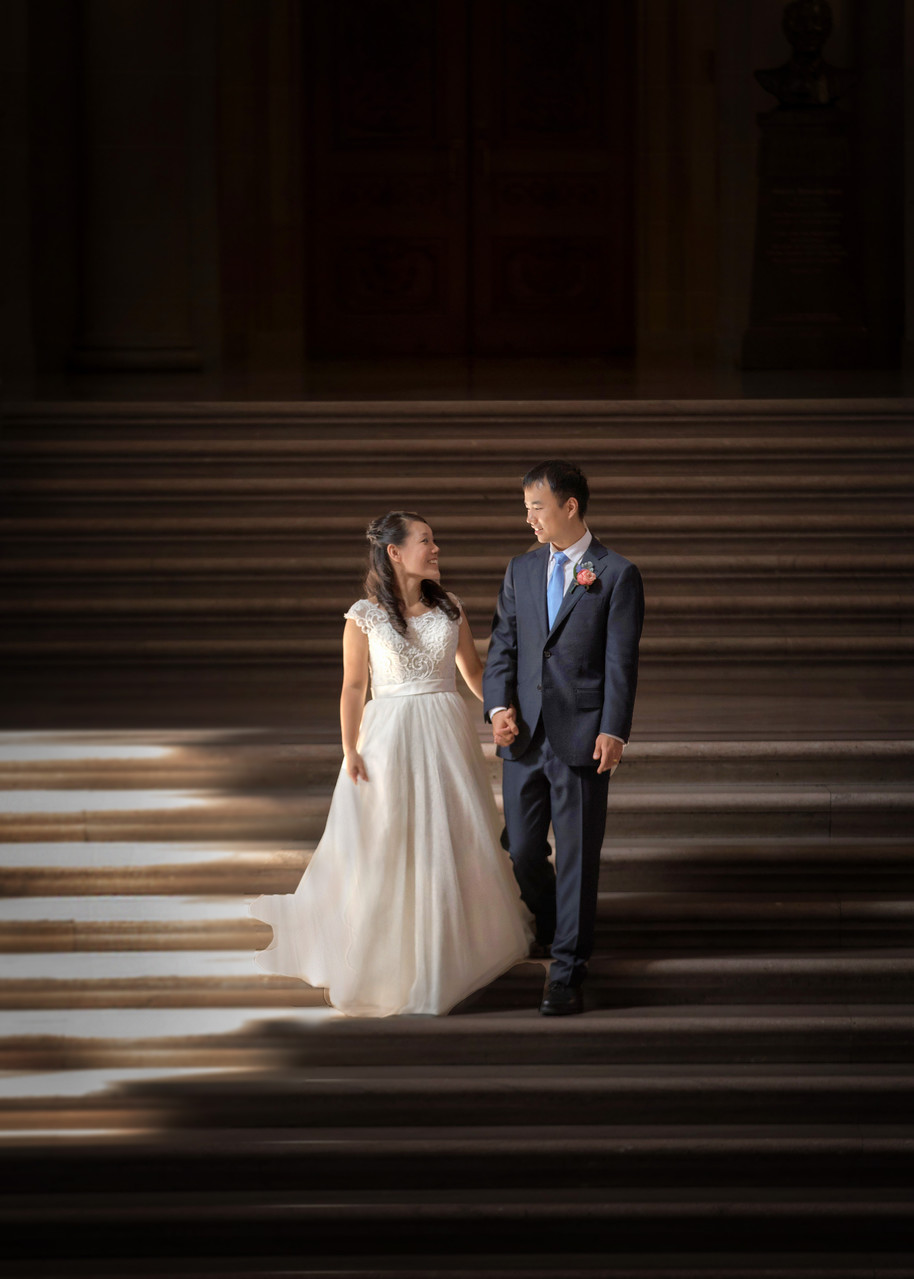 Wedding Bliss: Soft-Lit Couple's Tender Moment on Steps