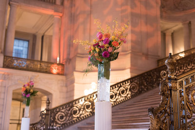 Grand Staircase with Elegant Floral Column Displa