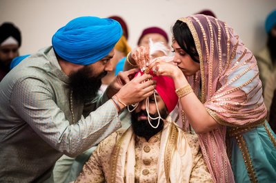Helping Groom with Turban at Sikh Wedding