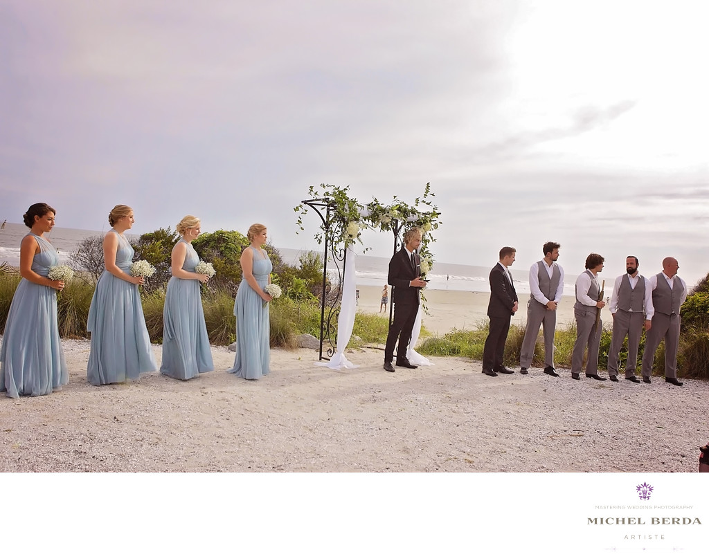 Groom and bridal party wedding ceremony at Sea Side Point Wild Dunes Resort