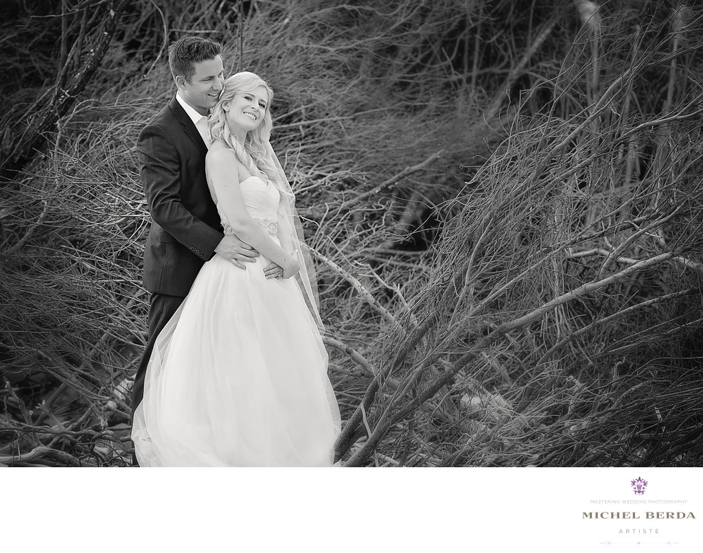Bride and Groom B&W by trees on the beach wedding ceremony at Sea Side Point Wild Dunes Resort