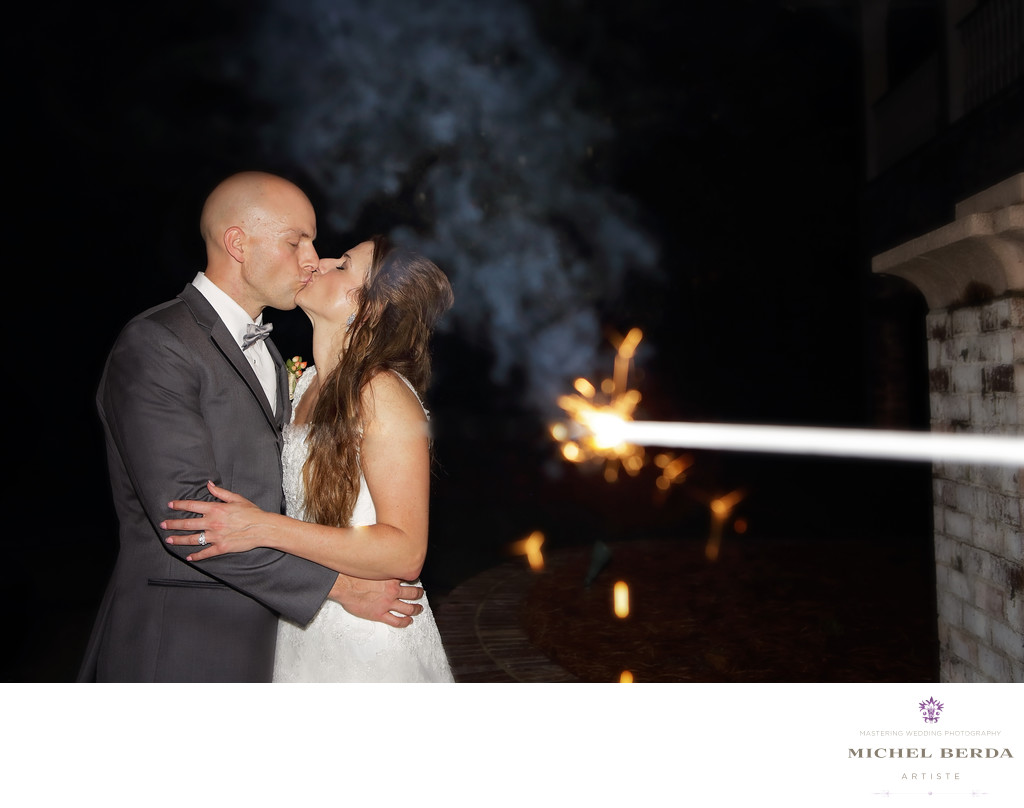 Leaving sparkler kiss bride and groom Dunes West Golf & River Club