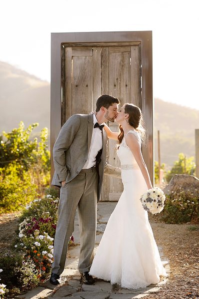 A Kiss at the Door To Nowhere Saddlerock Ranch Wedding - Los Angeles Wedding, Mitzvah & Portrait Photographer - Next Exit Photography