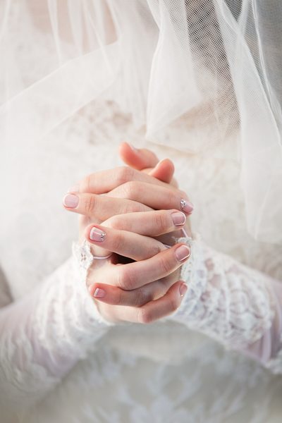 Bride with clasped hands