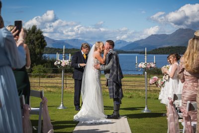 First kiss Loch Lomond wedding ceremony First kiss Loch Lomond wedding ceremony