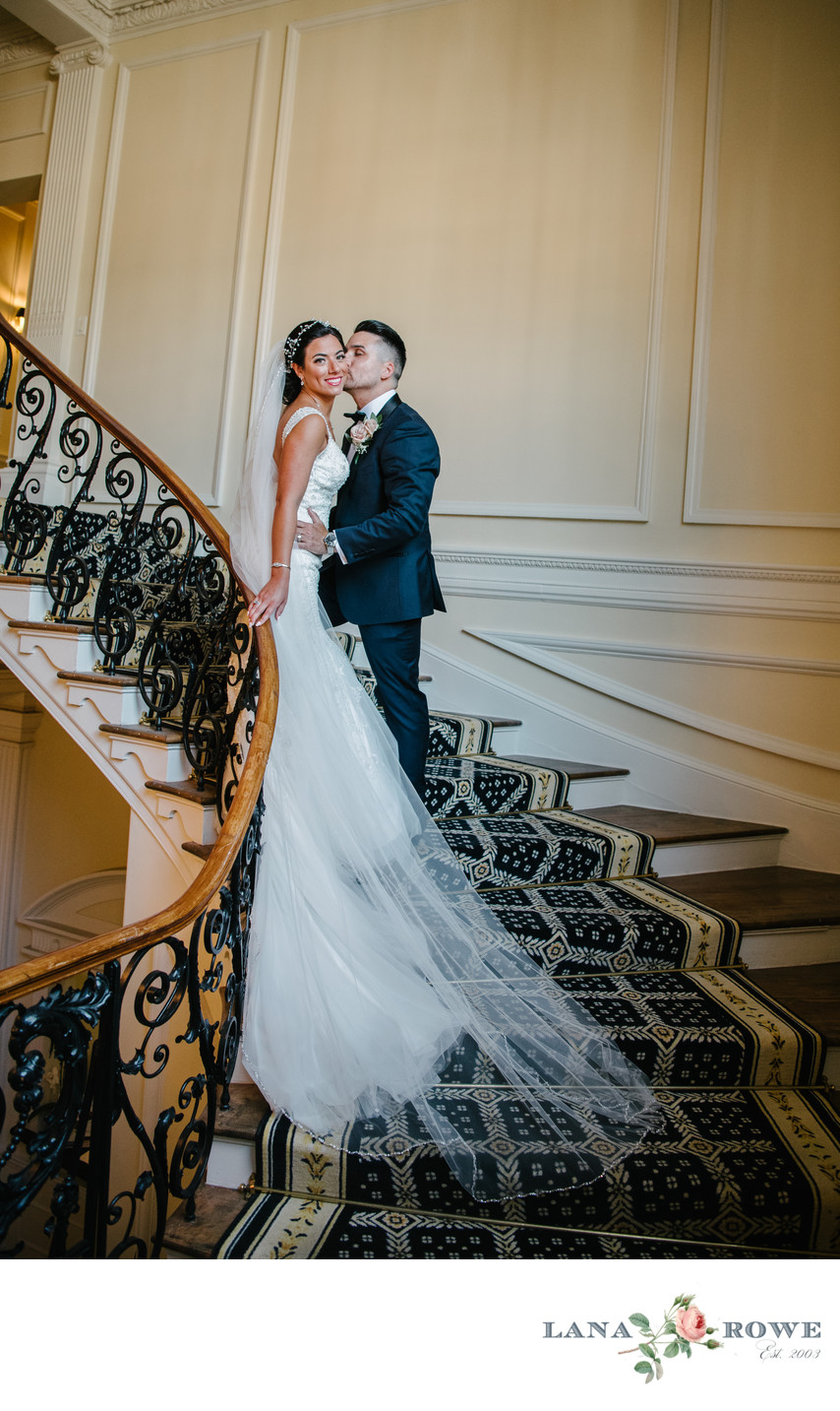 Bride and Groom on the staircase in the Muttontown Club