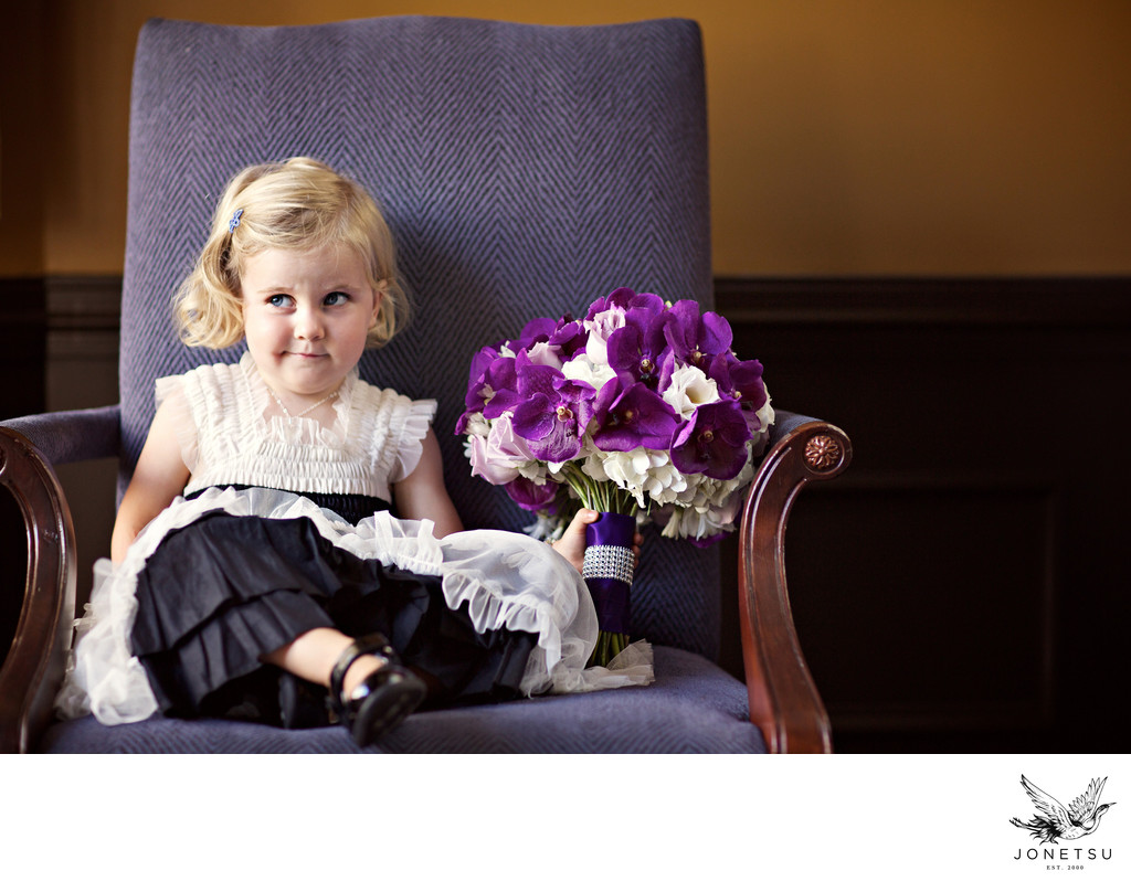 Flower girl is not impressed with this wedding bouquet 