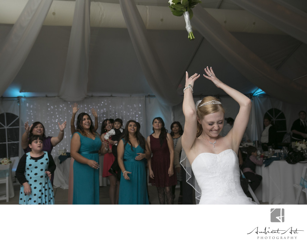 Bride throwing her bouquet.  Dinuba Wedding 