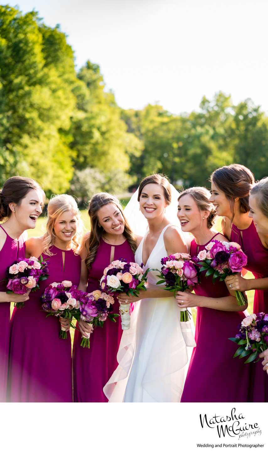 Candid photo of bride with bridesmaids outside