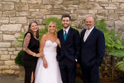 Grooms parents with newlyweds at St Charles wedding