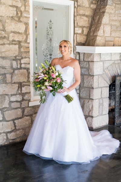 Full length photo of bride at bridal suite