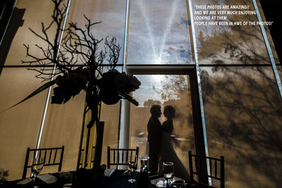 Silhouette of bride and groom before reception